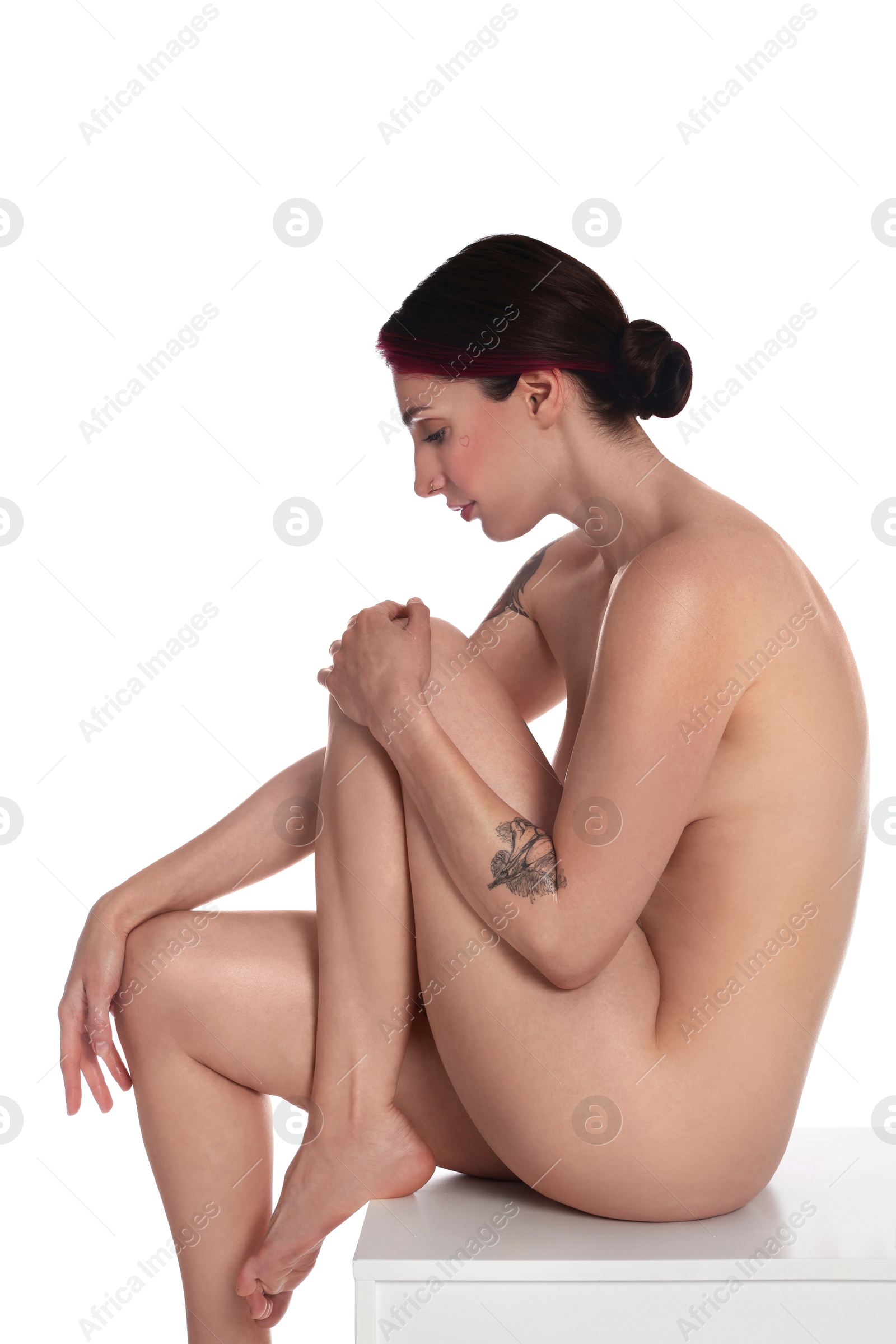 Photo of Beautiful nude woman posing on white background