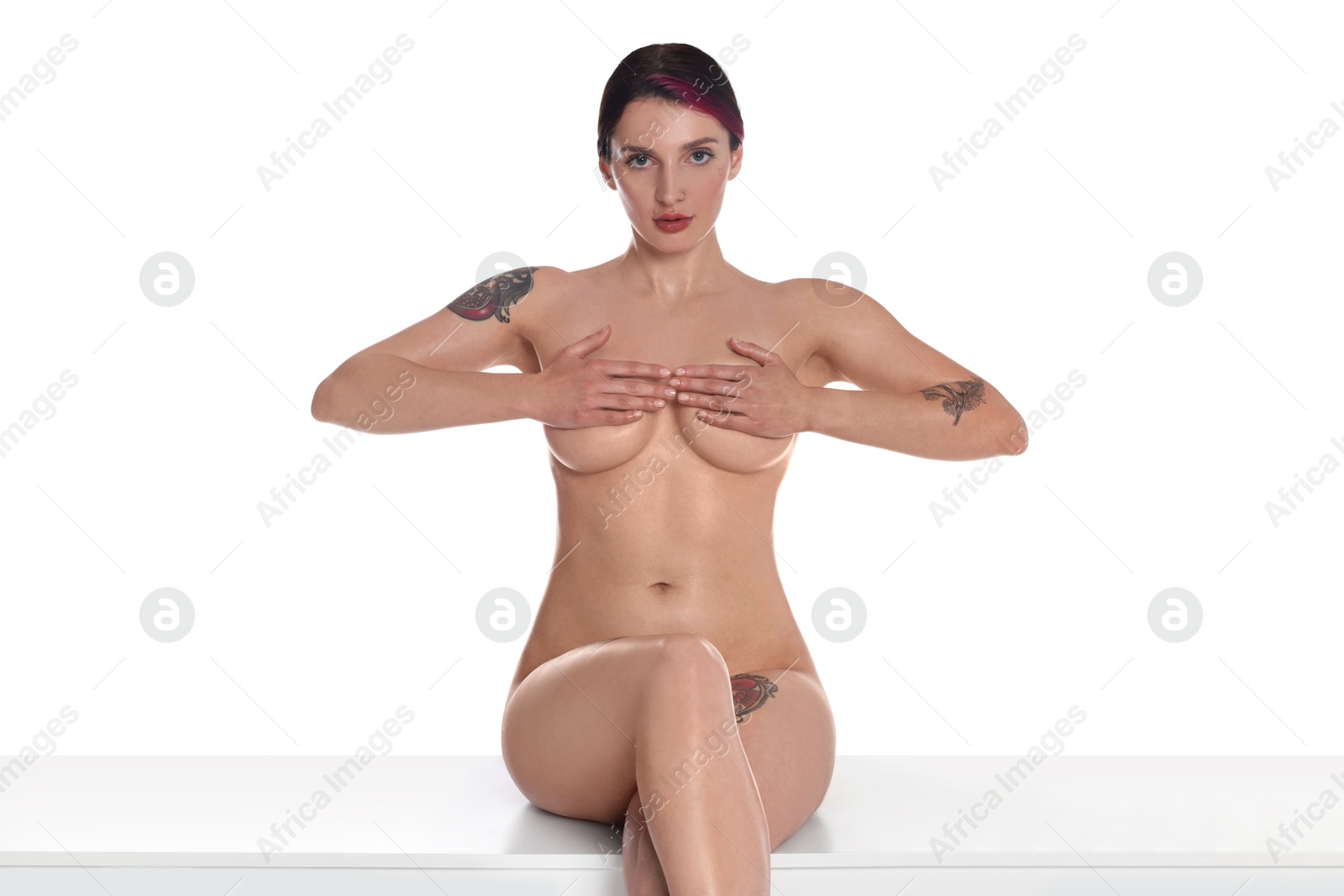 Photo of Beautiful nude woman posing on white background