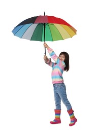 Cute little girl with colorful umbrella on white background