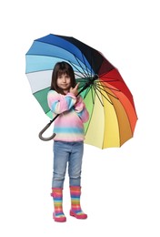 Cute little girl with colorful umbrella on white background