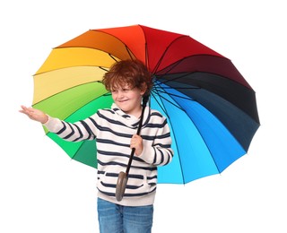 Photo of Little boy with rainbow umbrella on white background