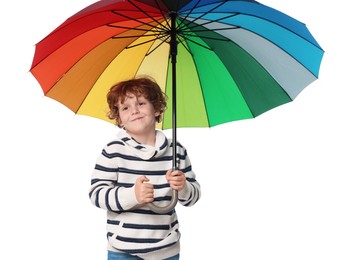 Little boy with rainbow umbrella on white background