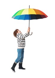 Photo of Little boy with rainbow umbrella on white background