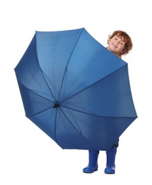 Little boy with blue umbrella on white background