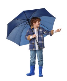 Photo of Little boy with blue umbrella on white background