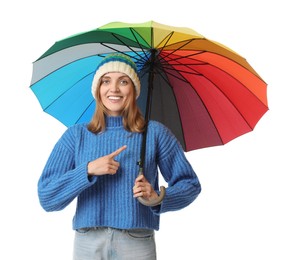 Photo of Woman with colorful umbrella pointing at something on white background