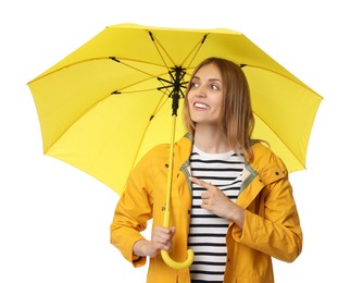 Photo of Woman with yellow umbrella pointing at something on white background