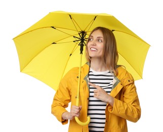 Woman with yellow umbrella pointing at something on white background