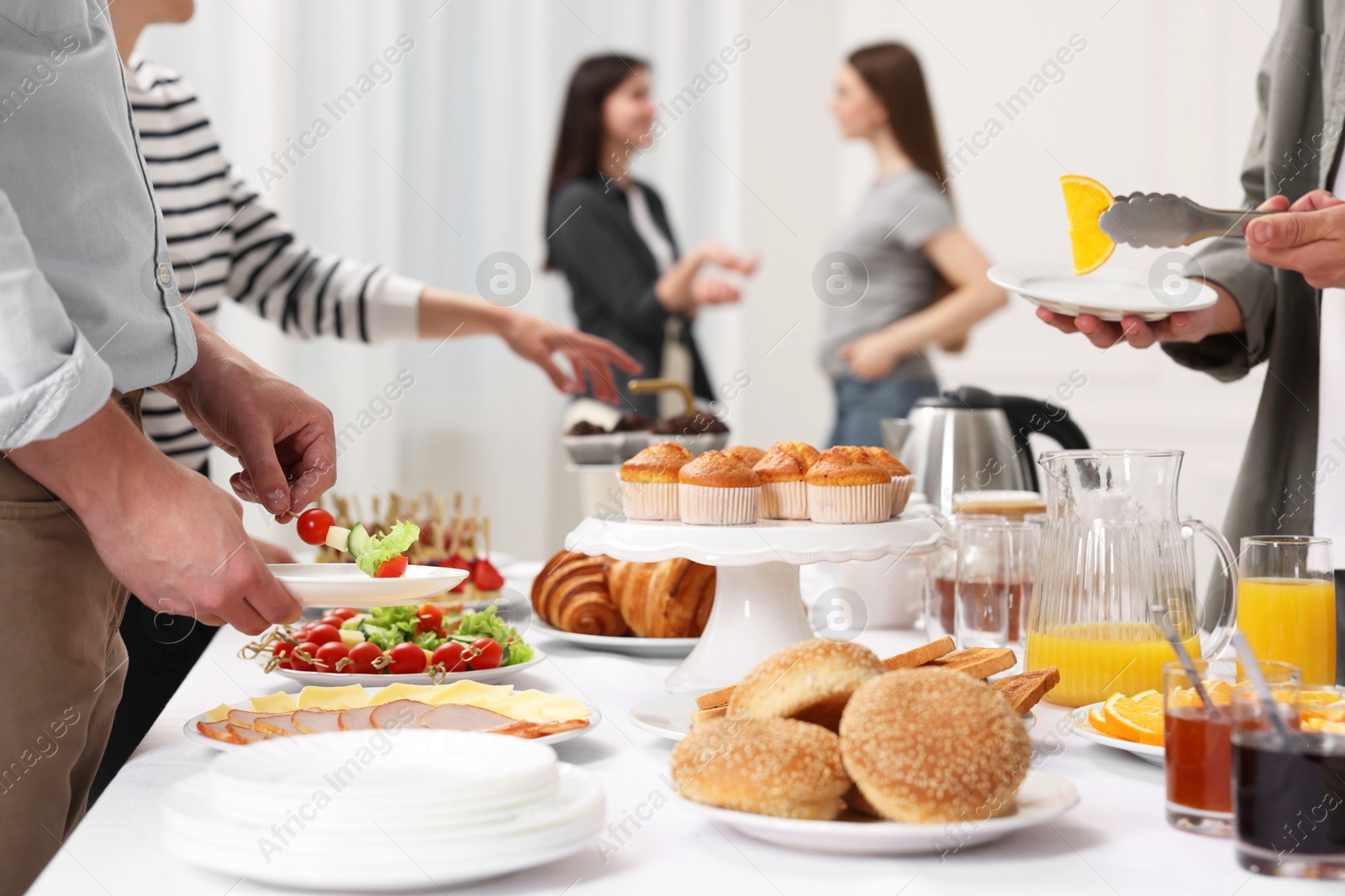 Photo of Coworkers having business lunch in restaurant, closeup