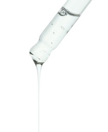 Dripping cosmetic serum from pipette on white background, closeup