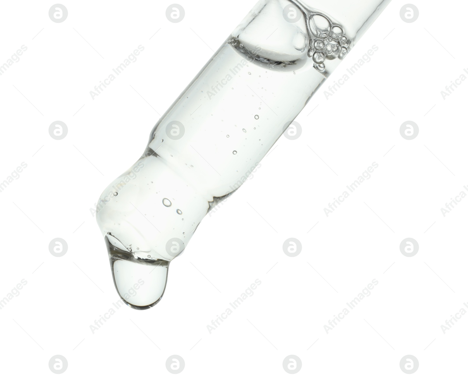 Photo of Dripping cosmetic serum from pipette on white background, closeup