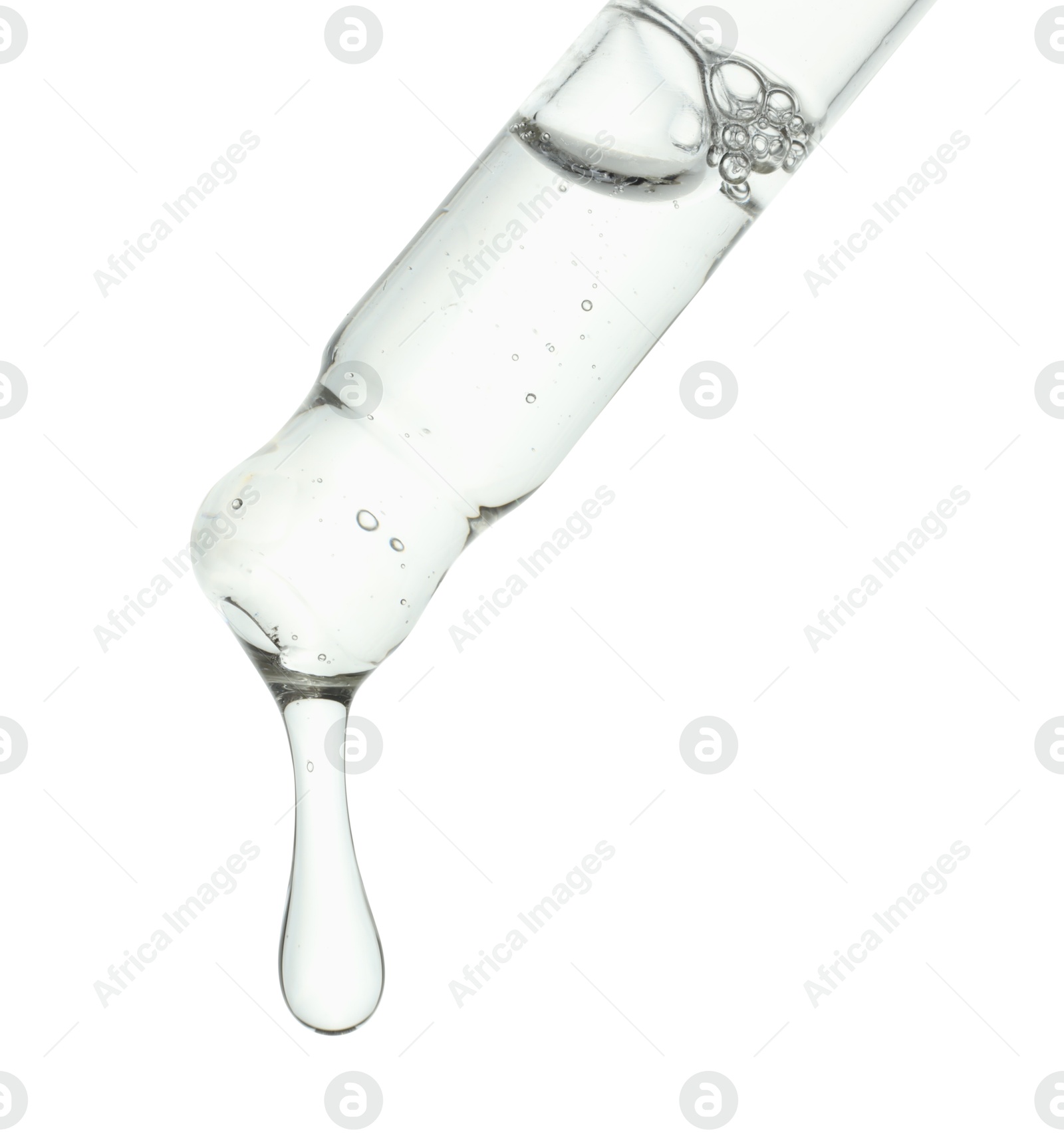 Photo of Dripping cosmetic serum from pipette on white background, closeup