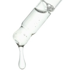 Photo of Dripping cosmetic serum from pipette on white background, closeup