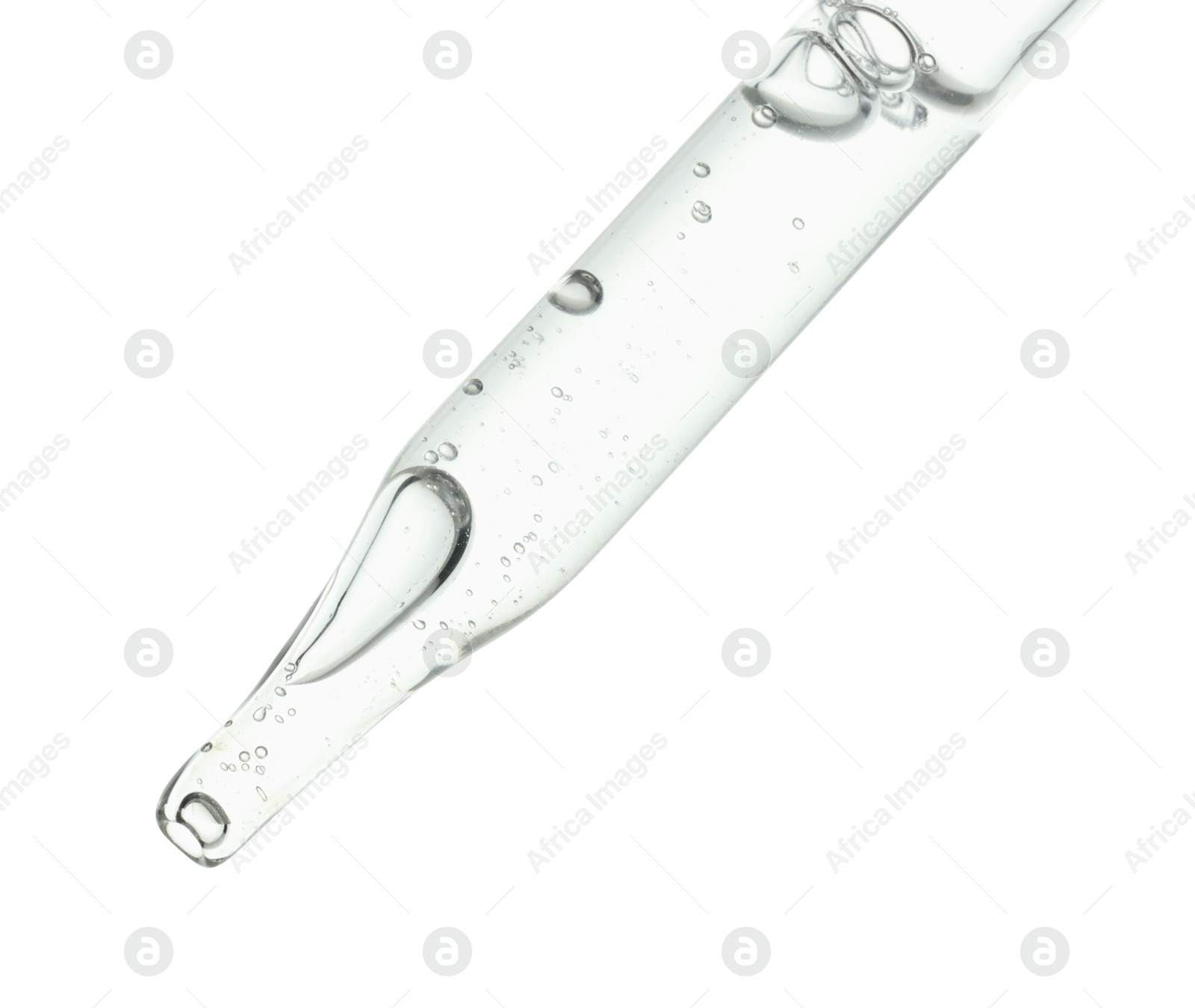 Photo of Dripping cosmetic serum from pipette on white background, closeup