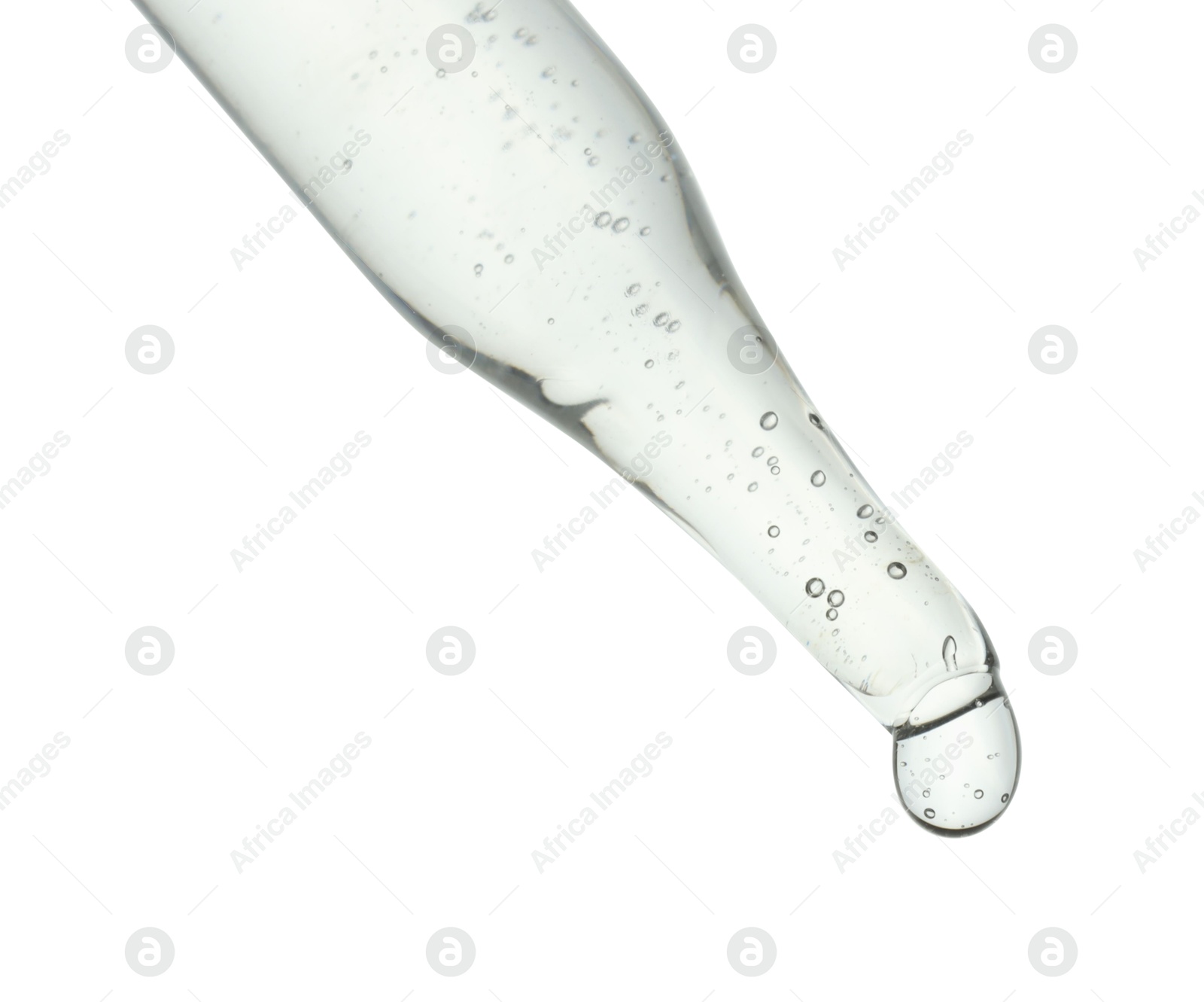 Photo of Dripping cosmetic serum from pipette on white background, closeup