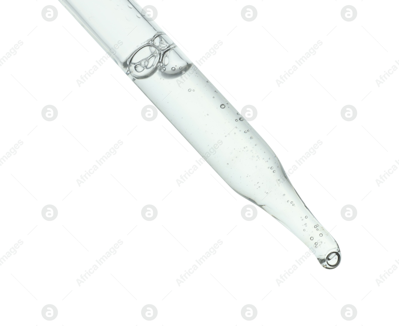 Photo of Dripping cosmetic serum from pipette on white background, closeup