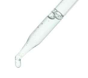 Dripping cosmetic serum from pipette on white background, closeup