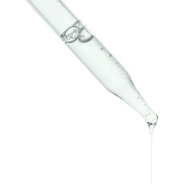 Dripping cosmetic serum from pipette on white background, closeup