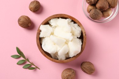 Natural shea butter and nuts on pink background, flat lay