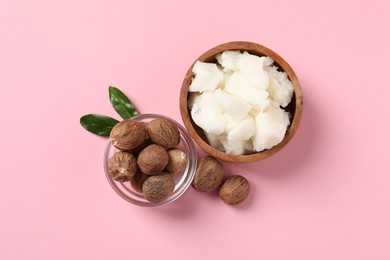 Photo of Natural shea butter and nuts on pink background, flat lay