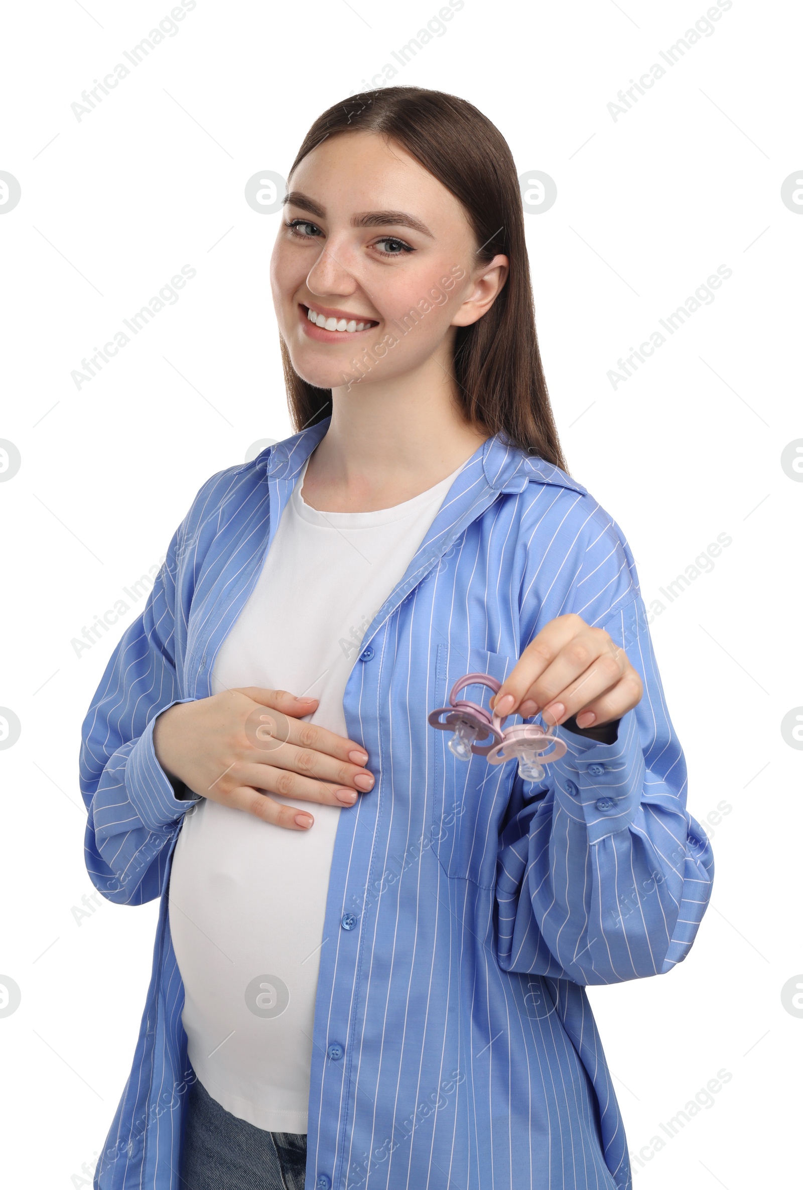 Photo of Expecting twins. Pregnant woman holding two pacifiers on white background