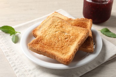 Photo of Delicious toasts served on wooden table, closeup