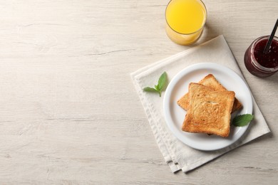 Photo of Delicious toasts served on wooden table, flat lay. Space for text