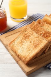 Delicious toasts served on wooden table, closeup