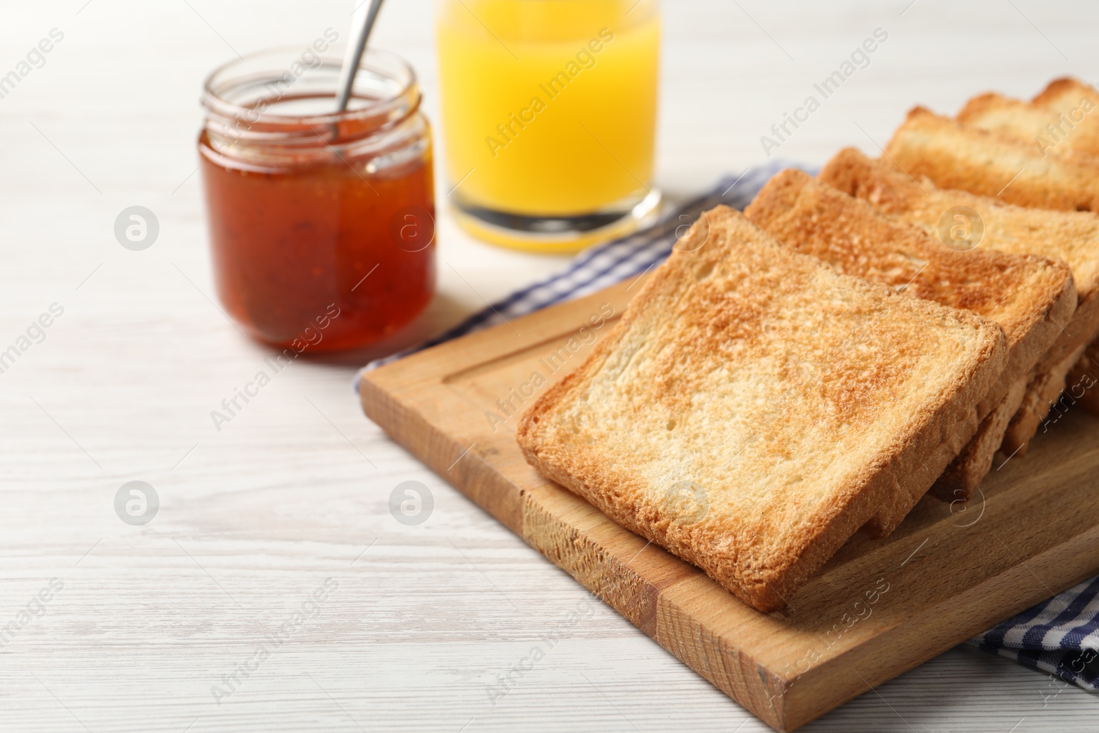 Photo of Delicious toasts served on wooden table, closeup