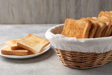 Slices of delicious toasted bread on light table