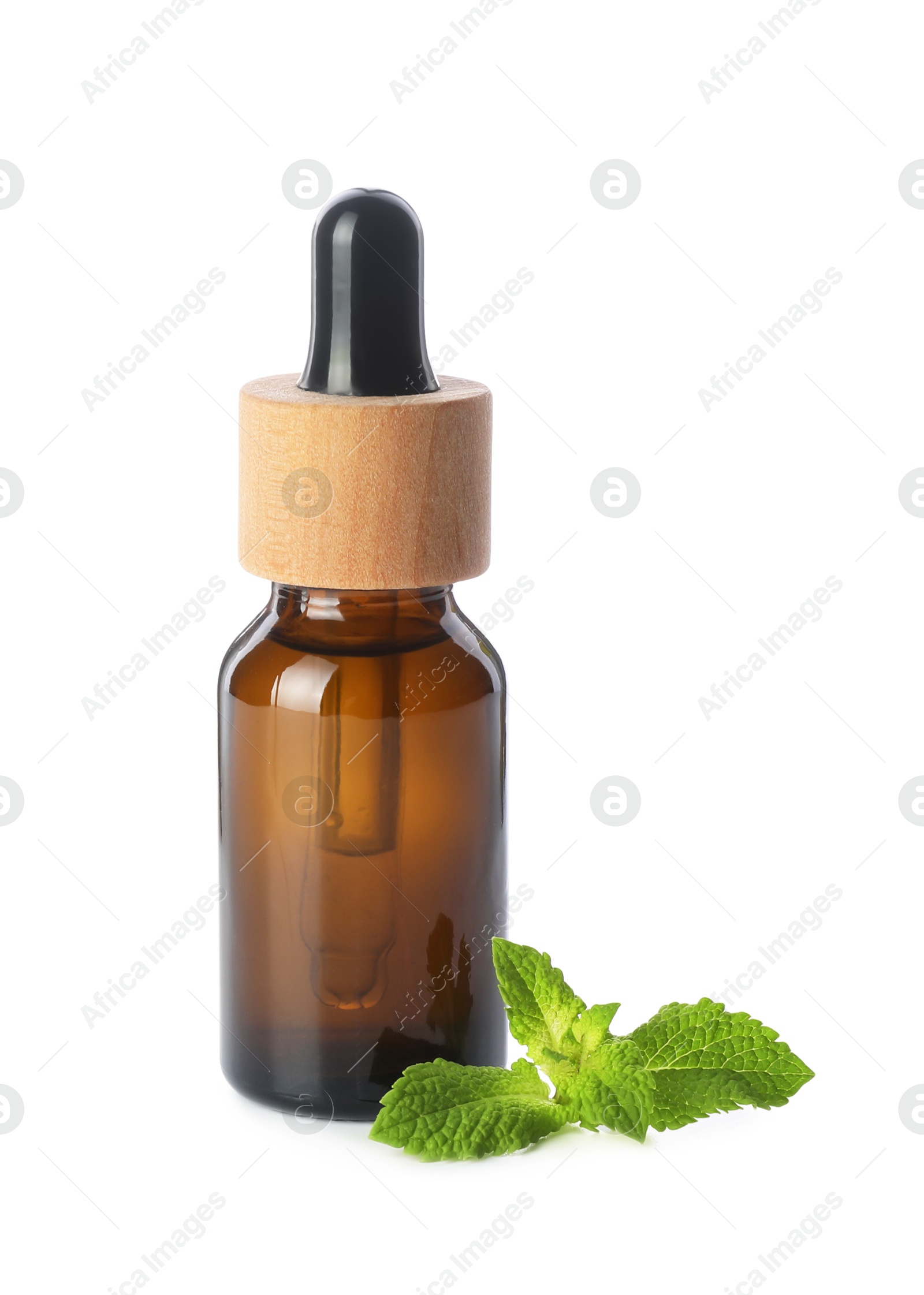 Photo of Bottle of essential oil and mint isolated on white