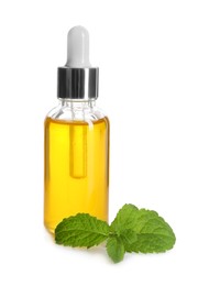 Photo of Bottle of essential oil and mint isolated on white