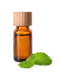 Photo of Bottle of essential oil and mint isolated on white