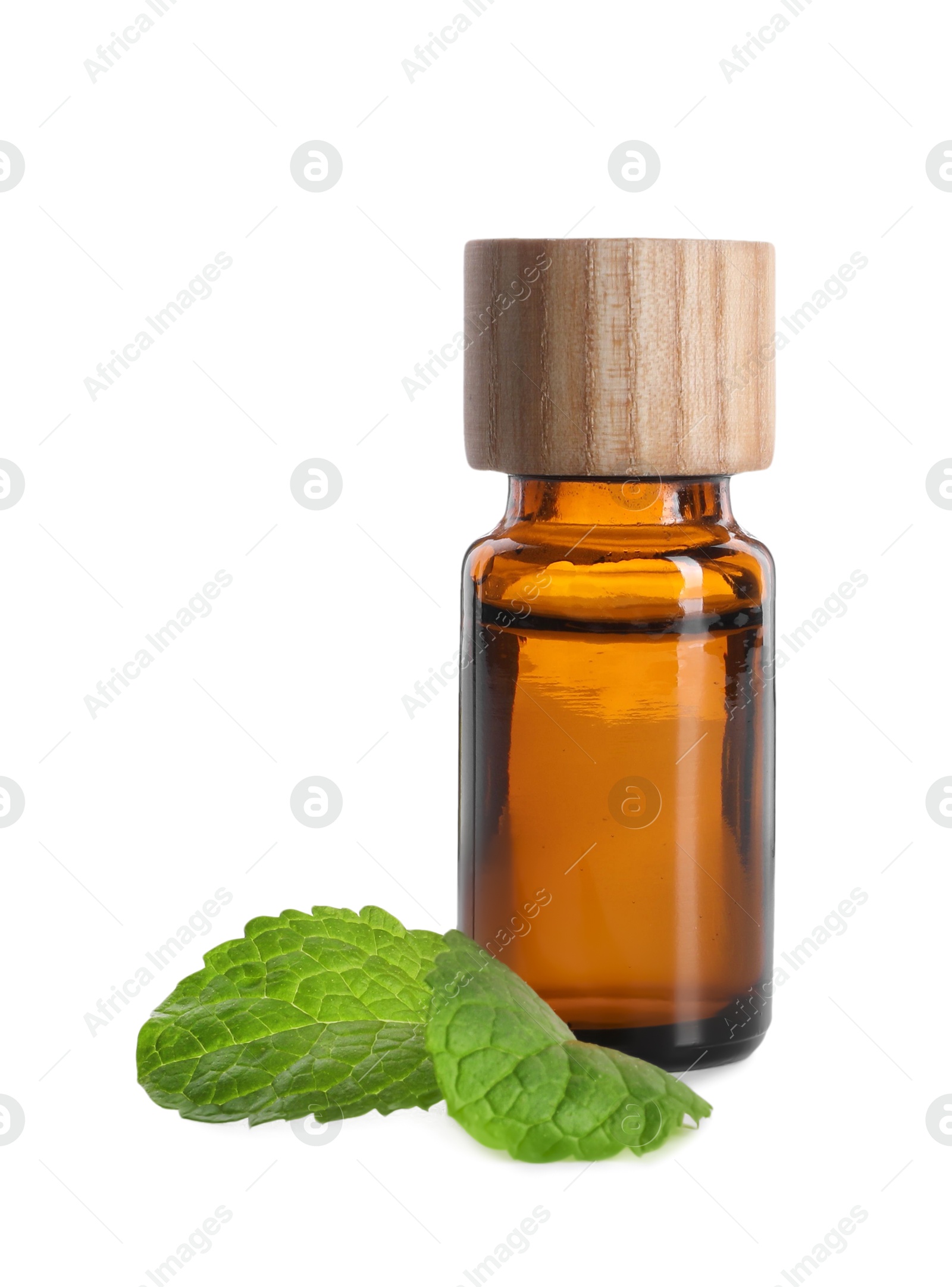 Photo of Bottle of essential oil and mint isolated on white