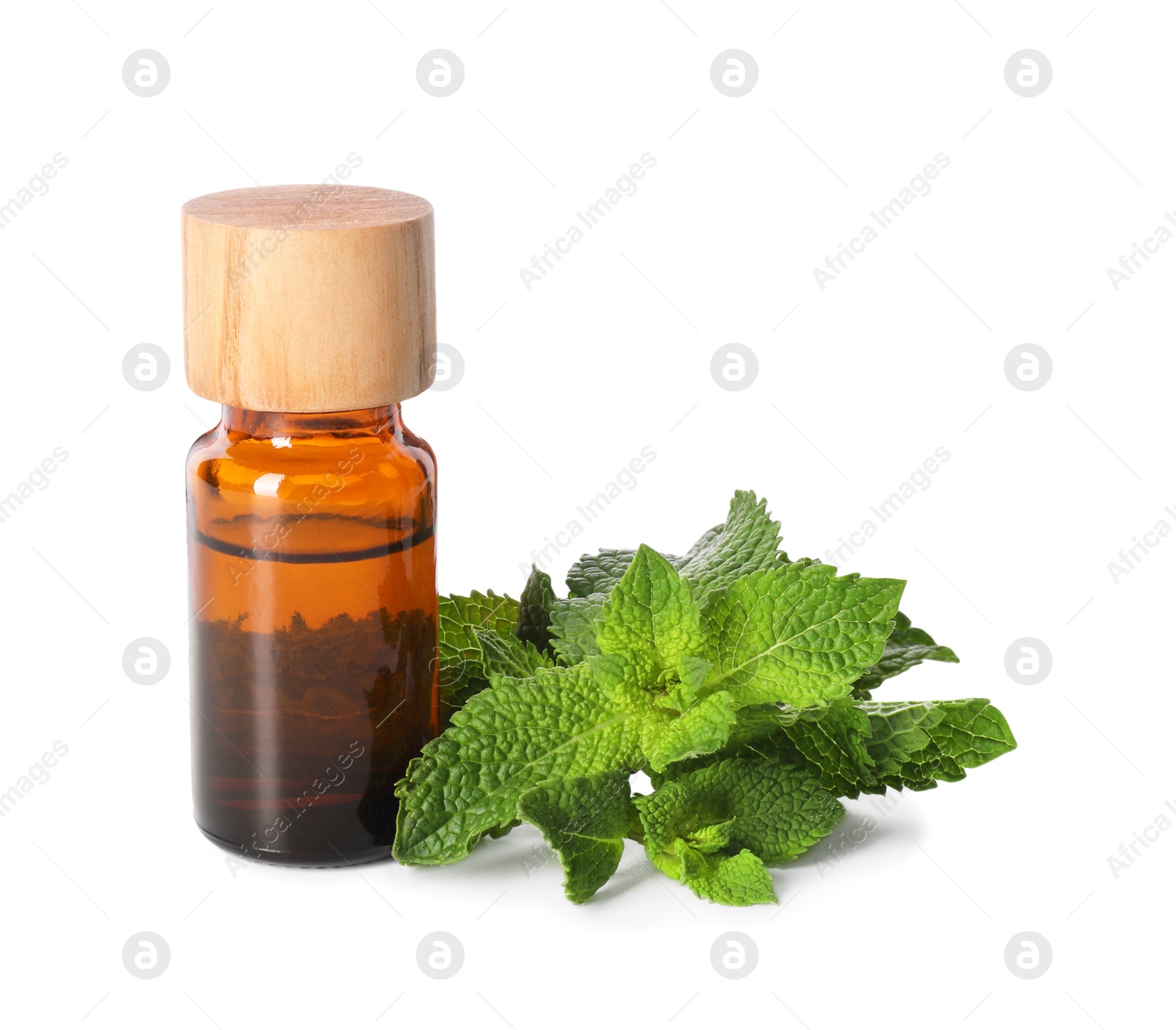 Photo of Bottle of essential oil and mint isolated on white