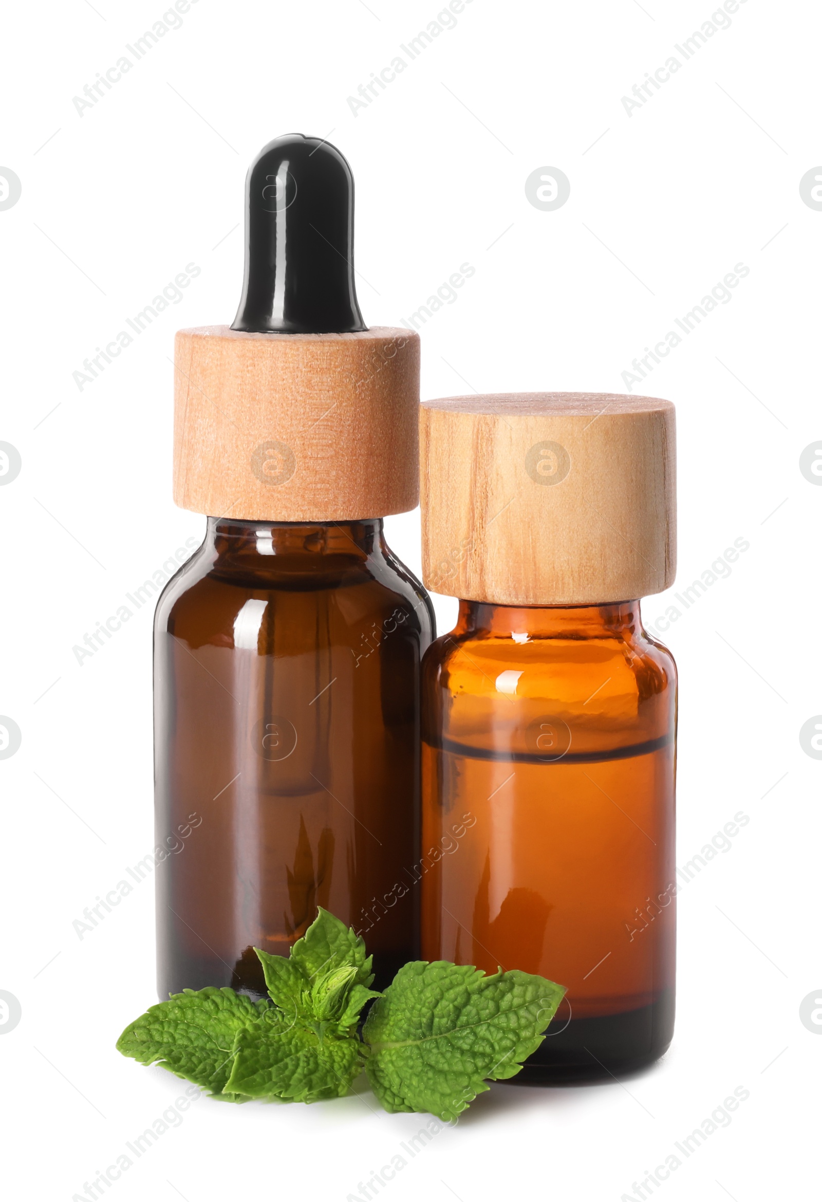 Photo of Bottles of essential oils and mint isolated on white