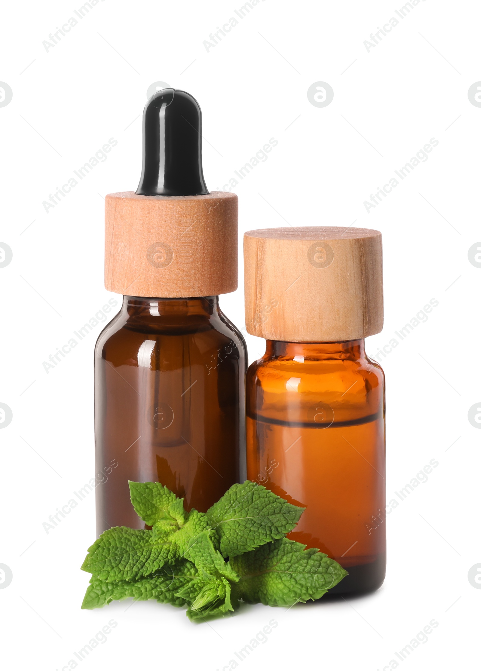 Photo of Bottles of essential oils and mint isolated on white