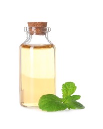 Photo of Bottle of essential oil and mint isolated on white