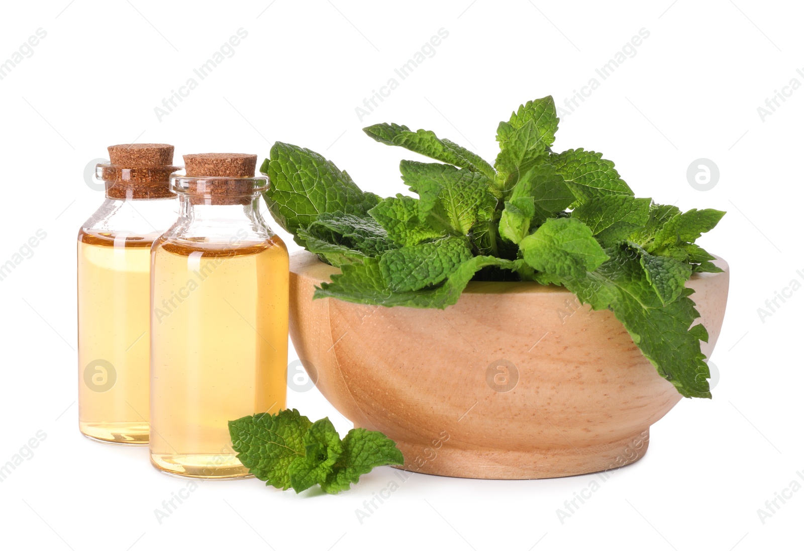 Photo of Bottles of essential oils and mint isolated on white