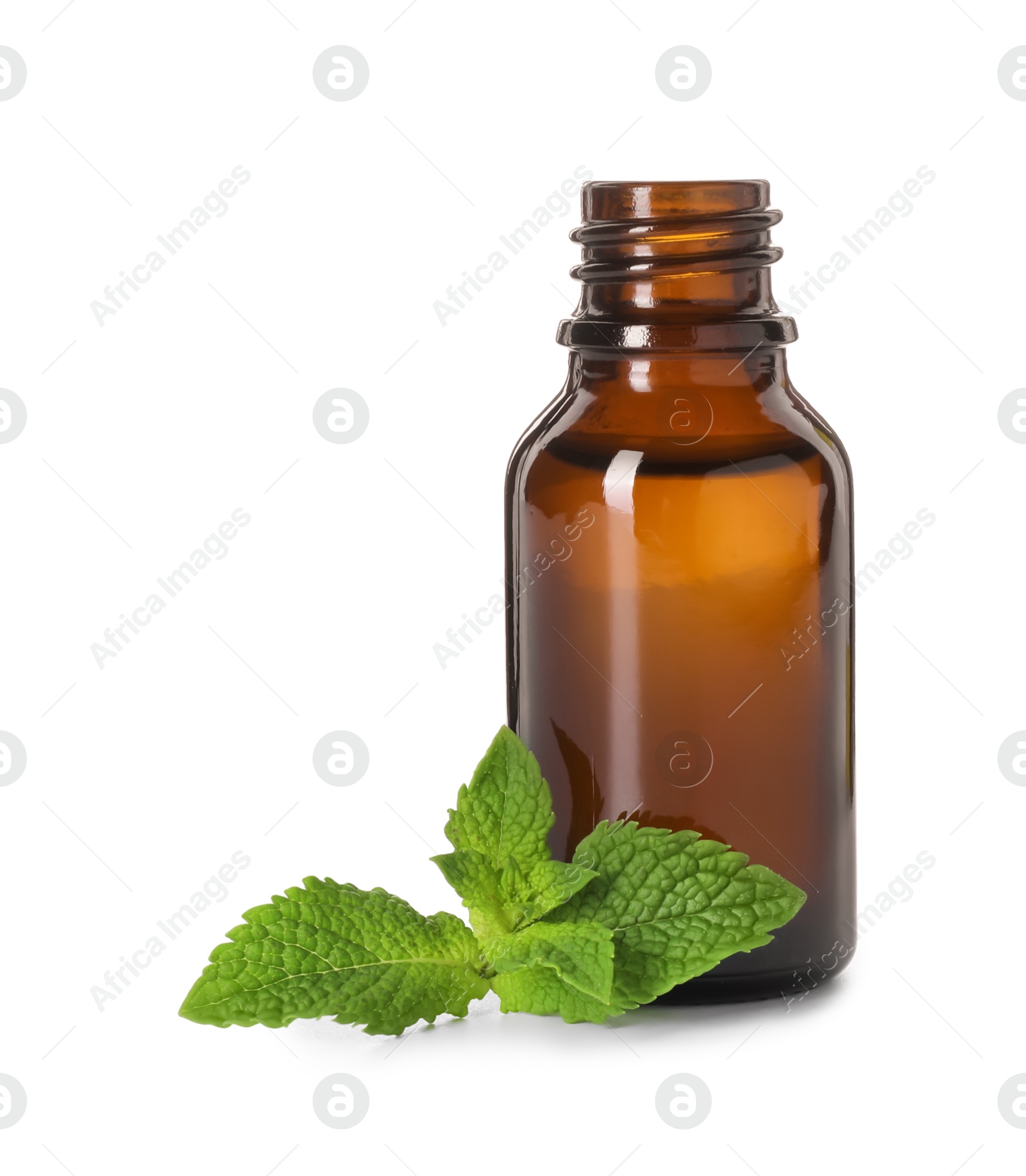 Photo of Bottle of essential oil and mint isolated on white