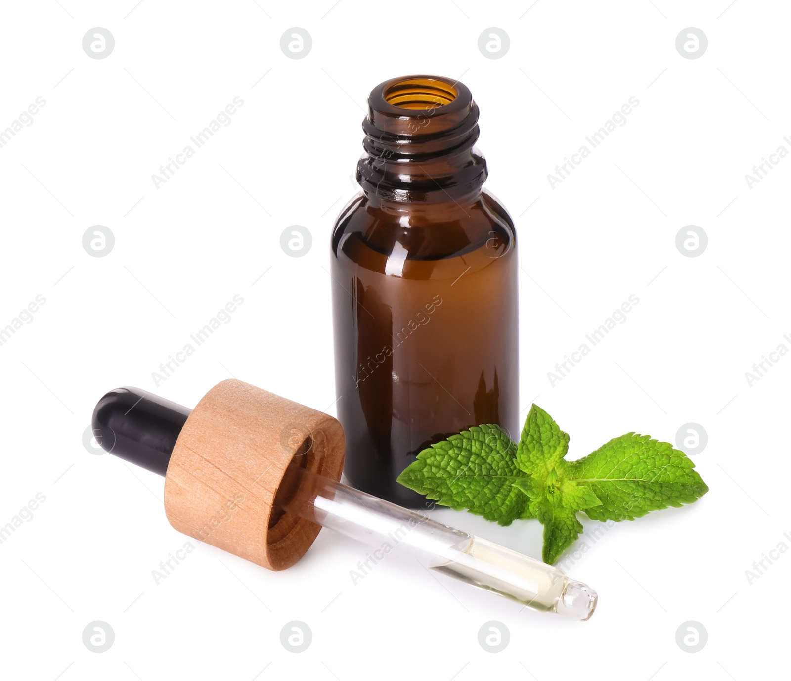 Photo of Bottle of essential oil, dropper and mint isolated on white