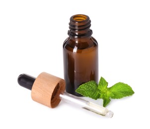 Bottle of essential oil, dropper and mint isolated on white