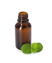 Bottle of essential oil and mint isolated on white