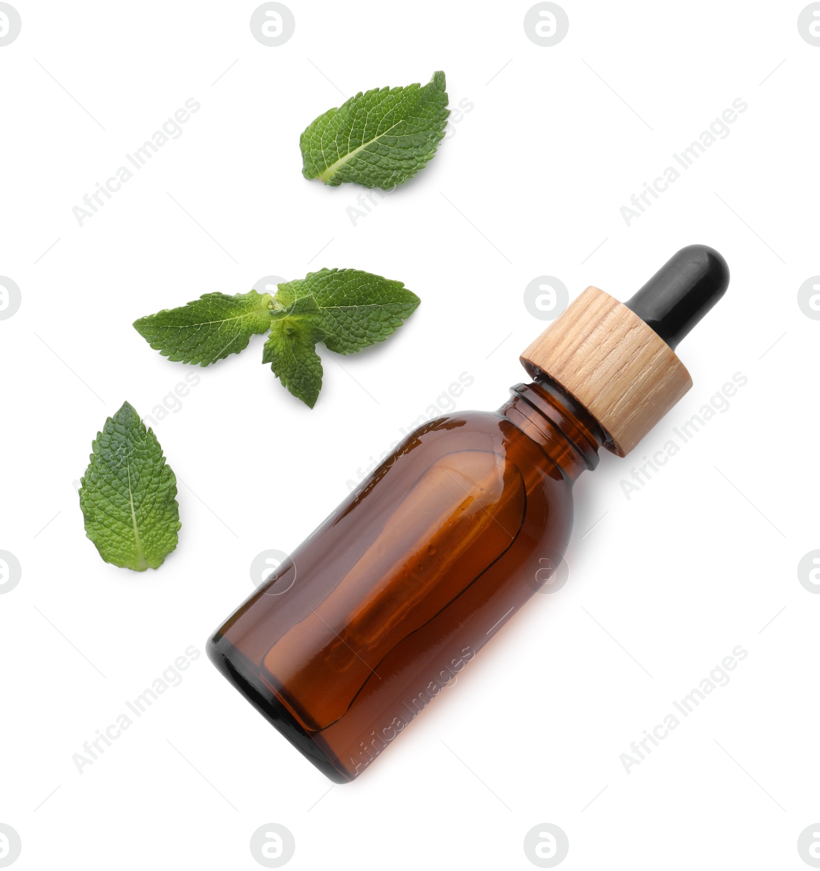 Photo of Bottle of essential oil and mint isolated on white, top view