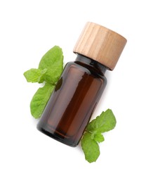 Photo of Bottle of essential oil and mint isolated on white, top view