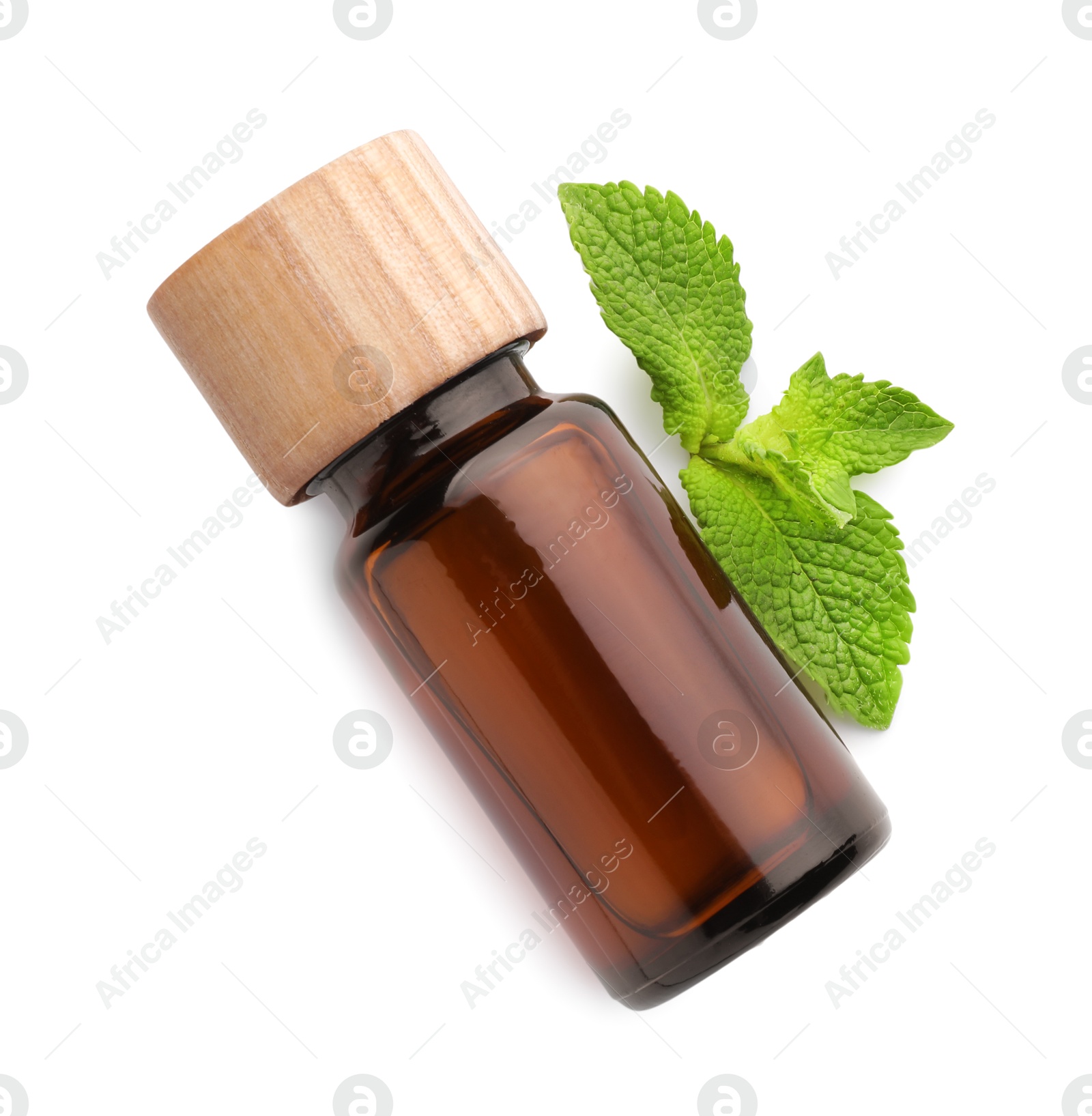 Photo of Bottle of essential oil and mint isolated on white, top view