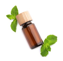 Photo of Bottle of essential oil and mint isolated on white, top view