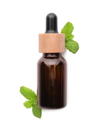 Photo of Bottle of essential oil and mint isolated on white, top view