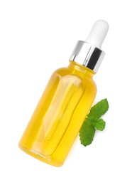 Photo of Bottle of essential oil and mint isolated on white, top view