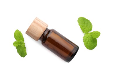 Bottle of essential oil and mint isolated on white, top view